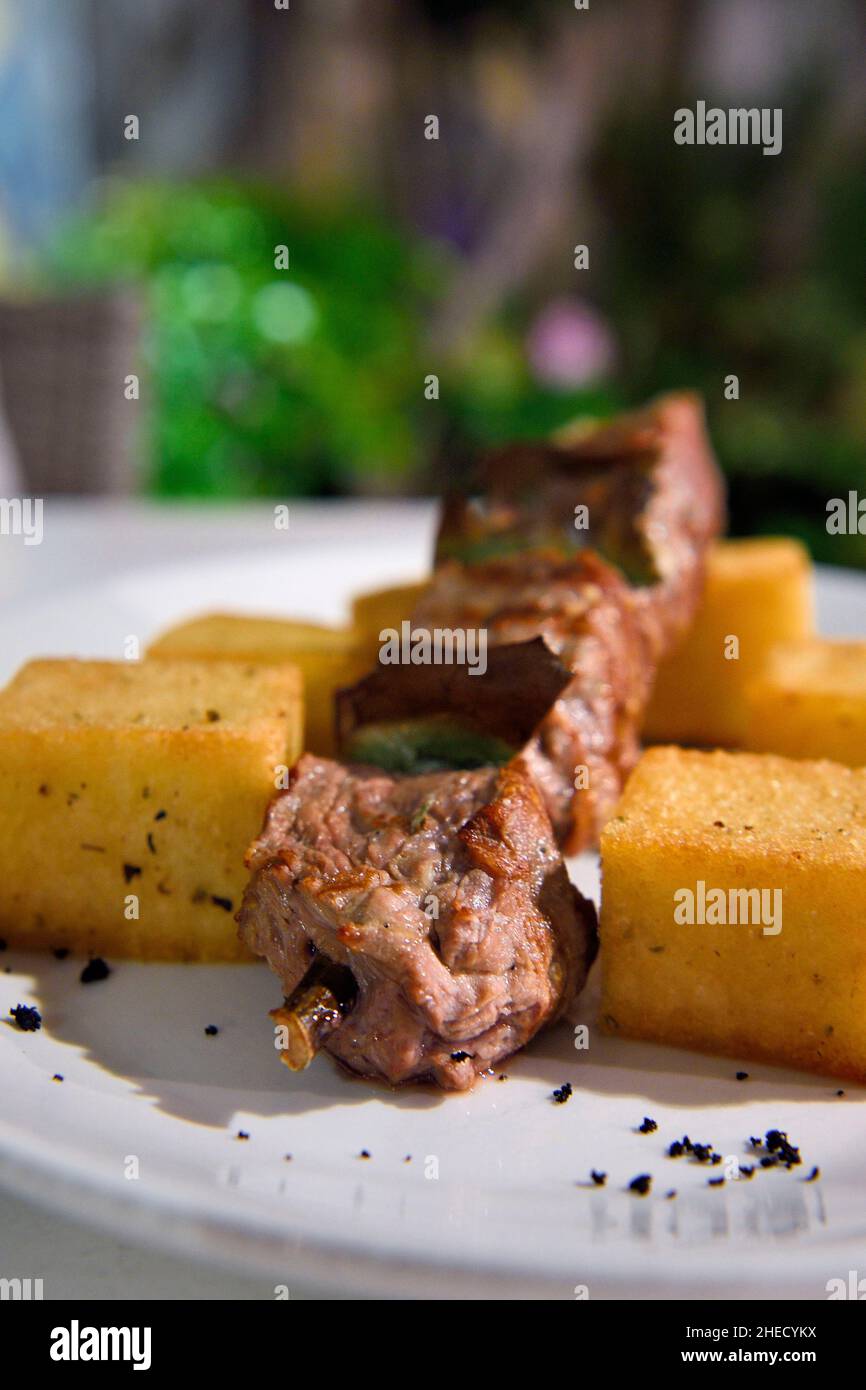 Portugal, Madeira Island, Funchal, beef skewer on a bay leaf and cooked over a wood fire Stock Photo