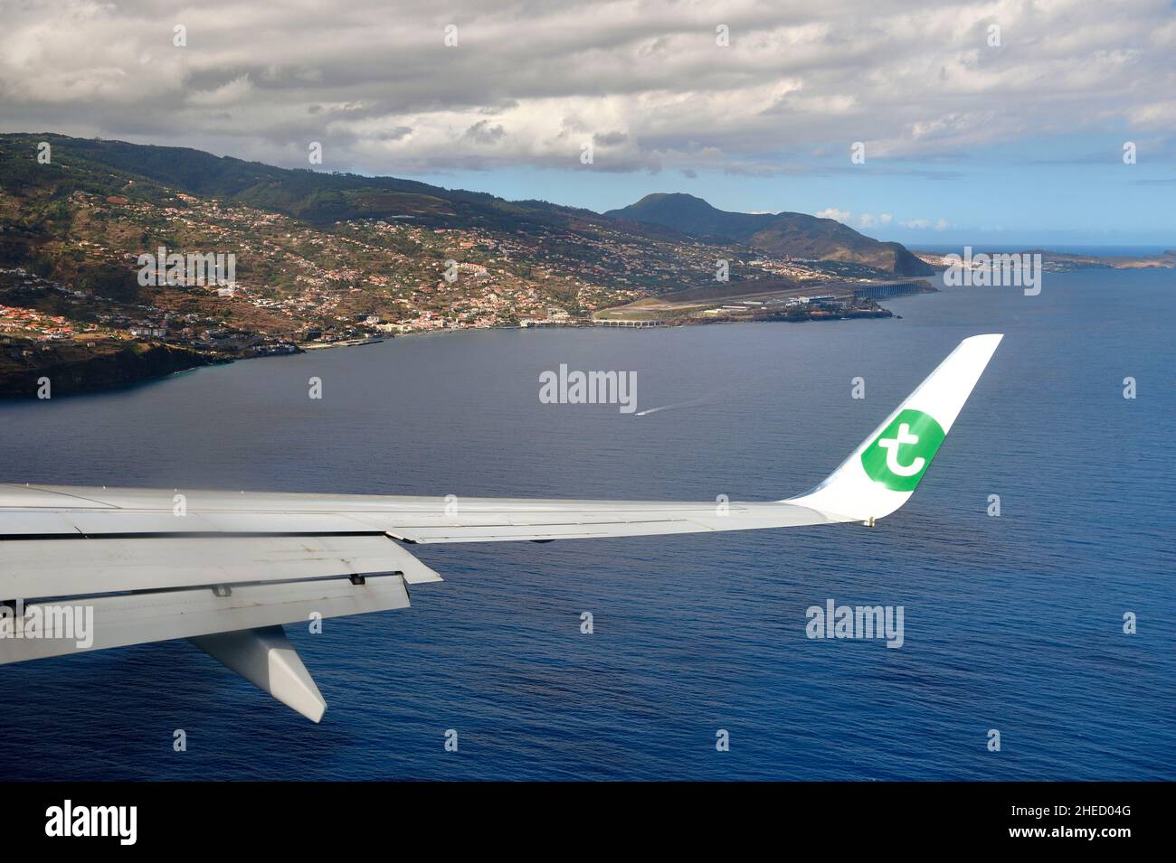 Portugal, Madeira Island, Madeira Cristiano-Ronaldo International Airport which has a 2781m runway extended over the sea thanks to pillars (aerial view) Stock Photo