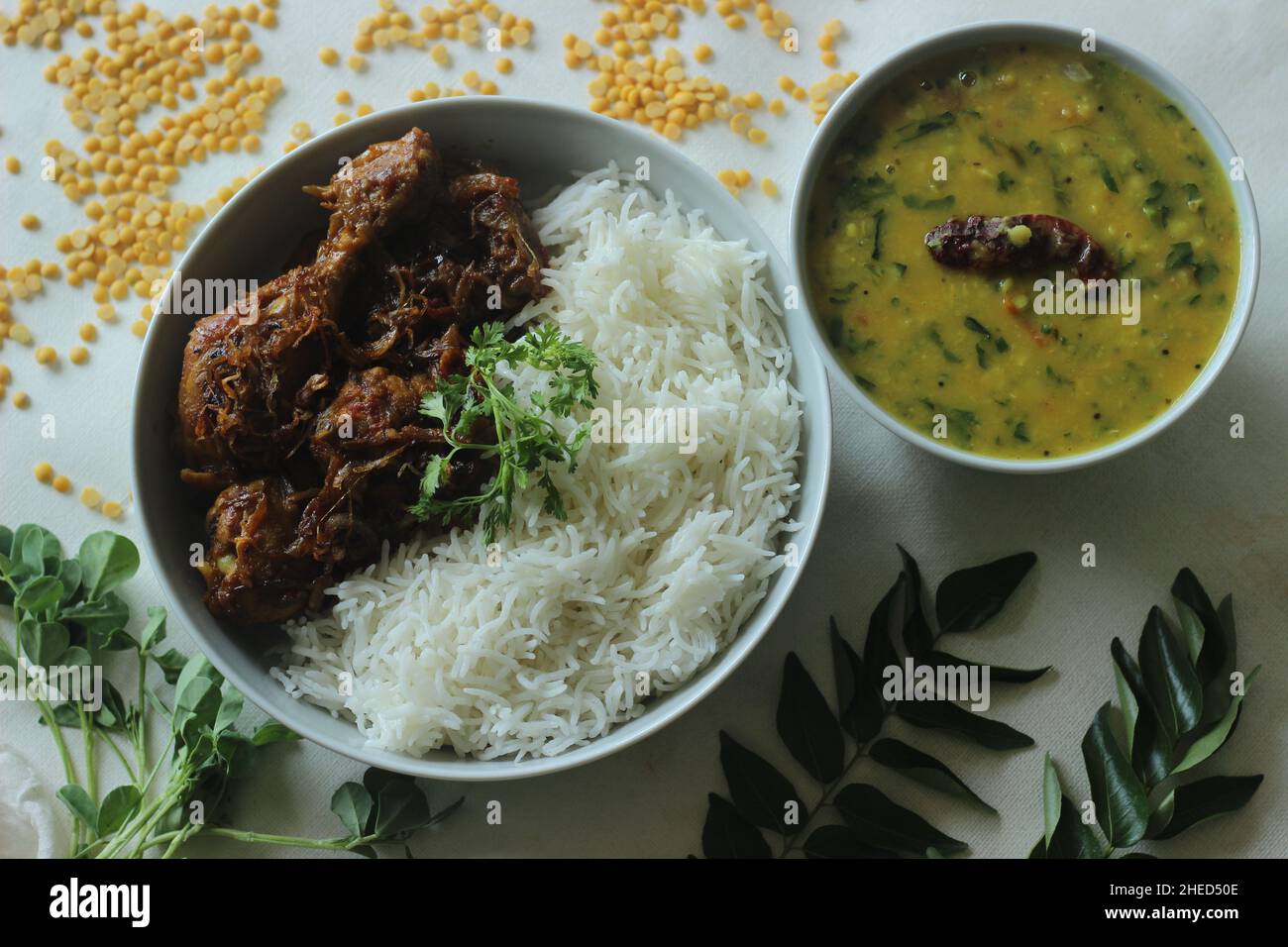 Kerala style dry chicken roast and lentil curry prepared with fenugreek