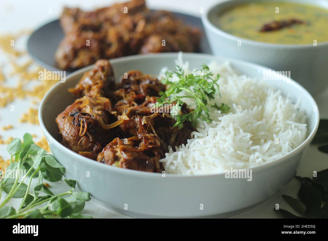 Kerala style dry chicken roast and lentil curry prepared with fenugreek