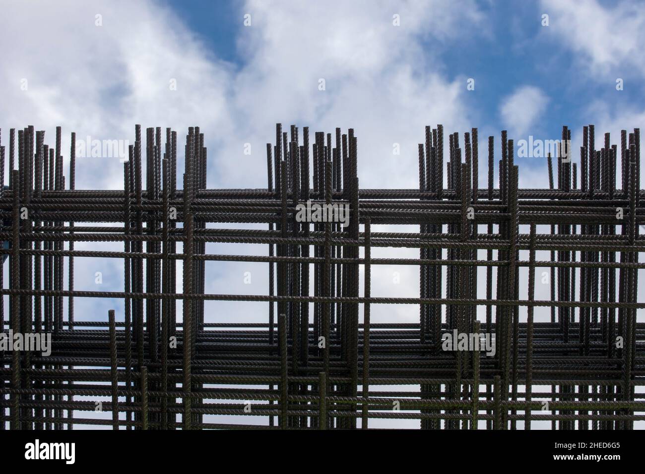 Reinforcing bars framework for armored concrete construction. Blue cloudy sky Stock Photo