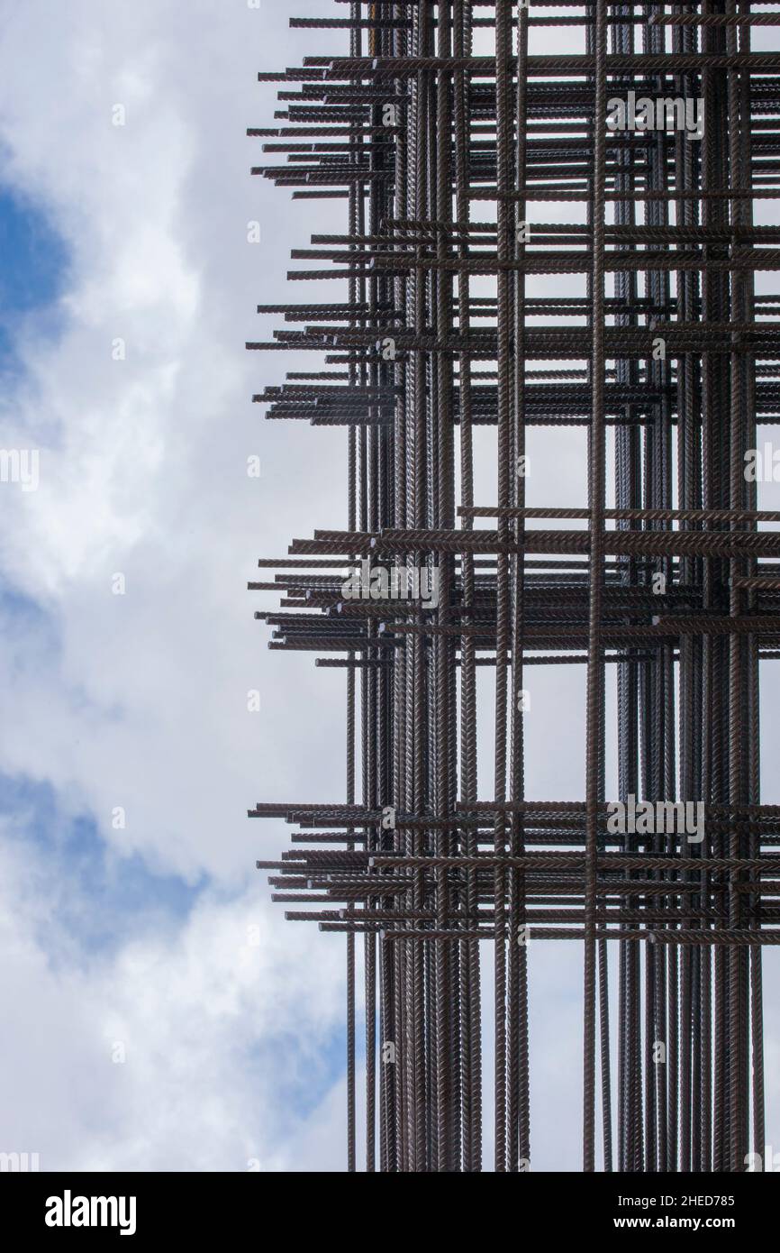 Reinforcing bars framework for armored concrete construction. Blue cloudy sky Stock Photo