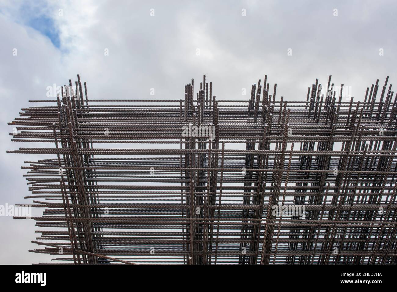 Reinforcing bars framework for armored concrete construction. Blue cloudy sky Stock Photo