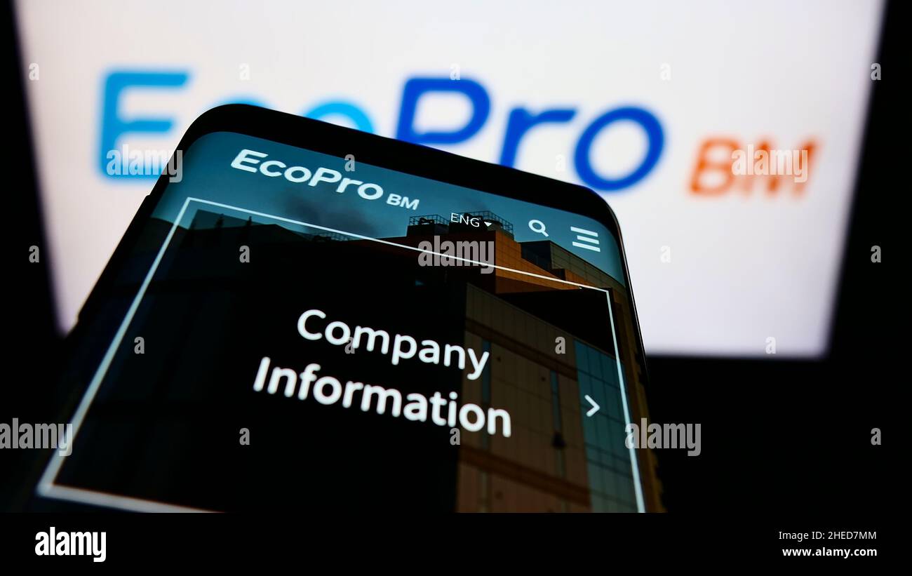 Mobile phone with website of South Korean company Ecopro BM Co. Ltd. on screen in front of business logo. Focus on top-left of phone display. Stock Photo