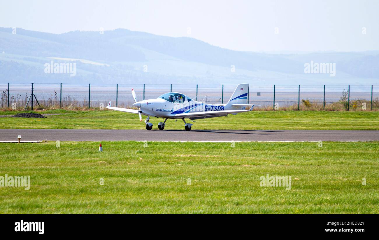 Tayside Aviation G-TSDB Aquila 211, a German-made light aircraft takes off from Dundee Airport in Scotland, UK Stock Photo