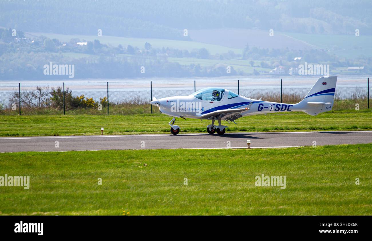 Tayside Aviation G-TSDC Aquila 211, a German-made light aircraft takes off from Dundee Airport in Scotland, UK Stock Photo