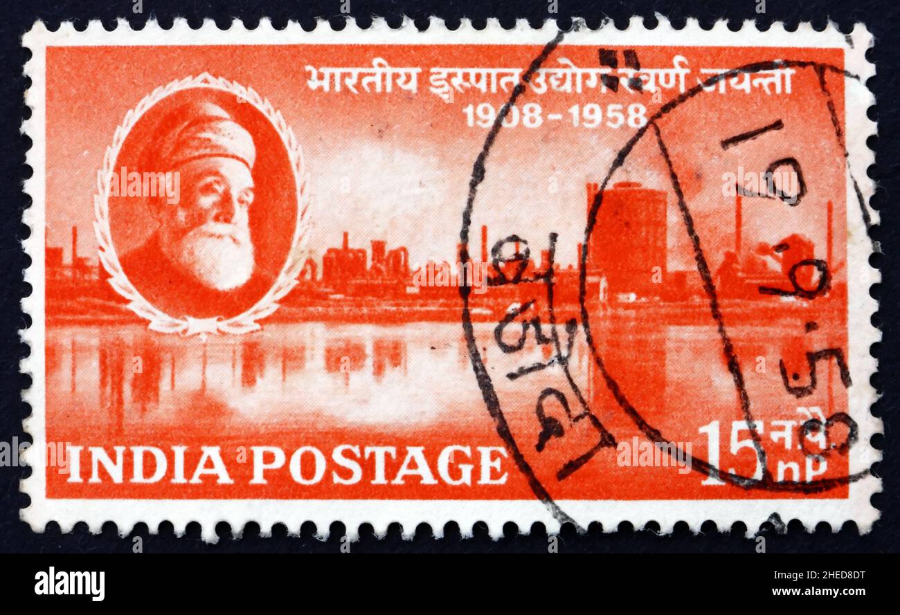 INDIA - CIRCA 1958: a stamp printed in India shows Jamsetji Nusserwanji Tata and Steel Works, Jamshedpur, 50th Anniversary of Indian Steel Industry, c Stock Photo