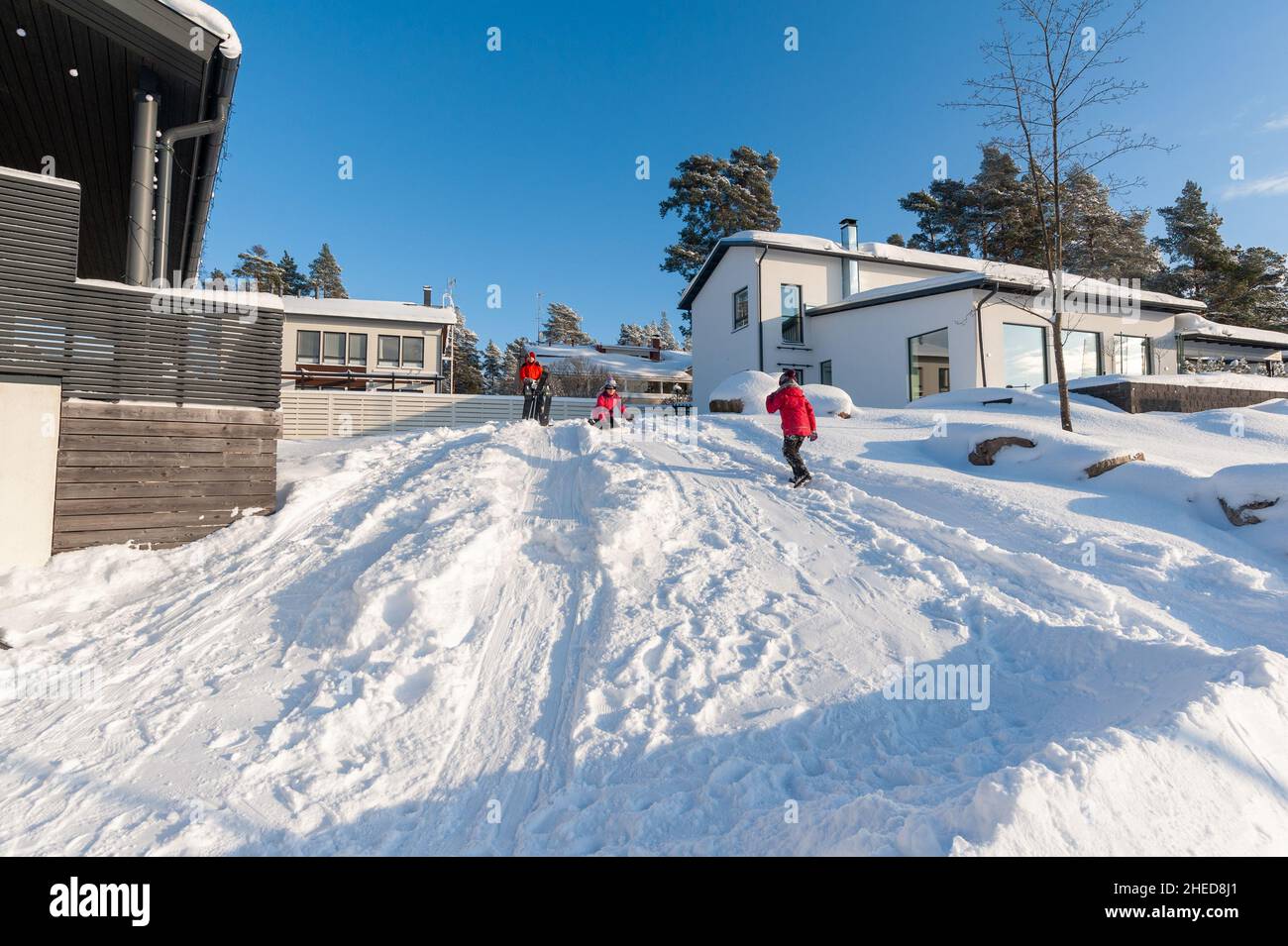 Kids playing in the snow, Espoo, Finland Stock Photo