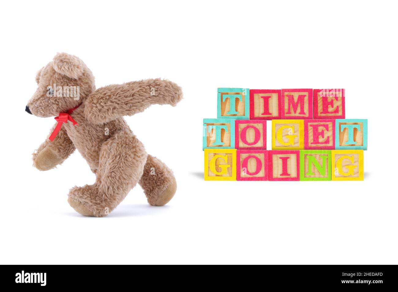 Time to get going business concept with wood blocks and teddy bear Stock Photo