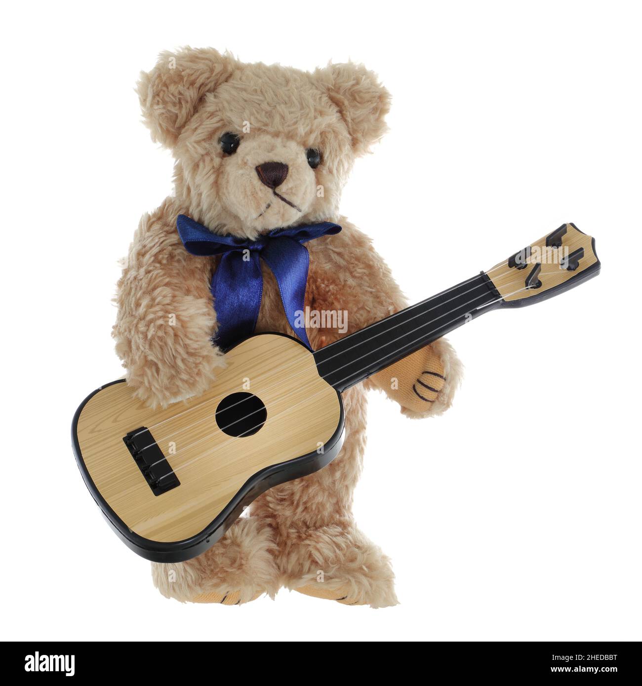 Cute brown teddy bear playing a guitar Stock Photo