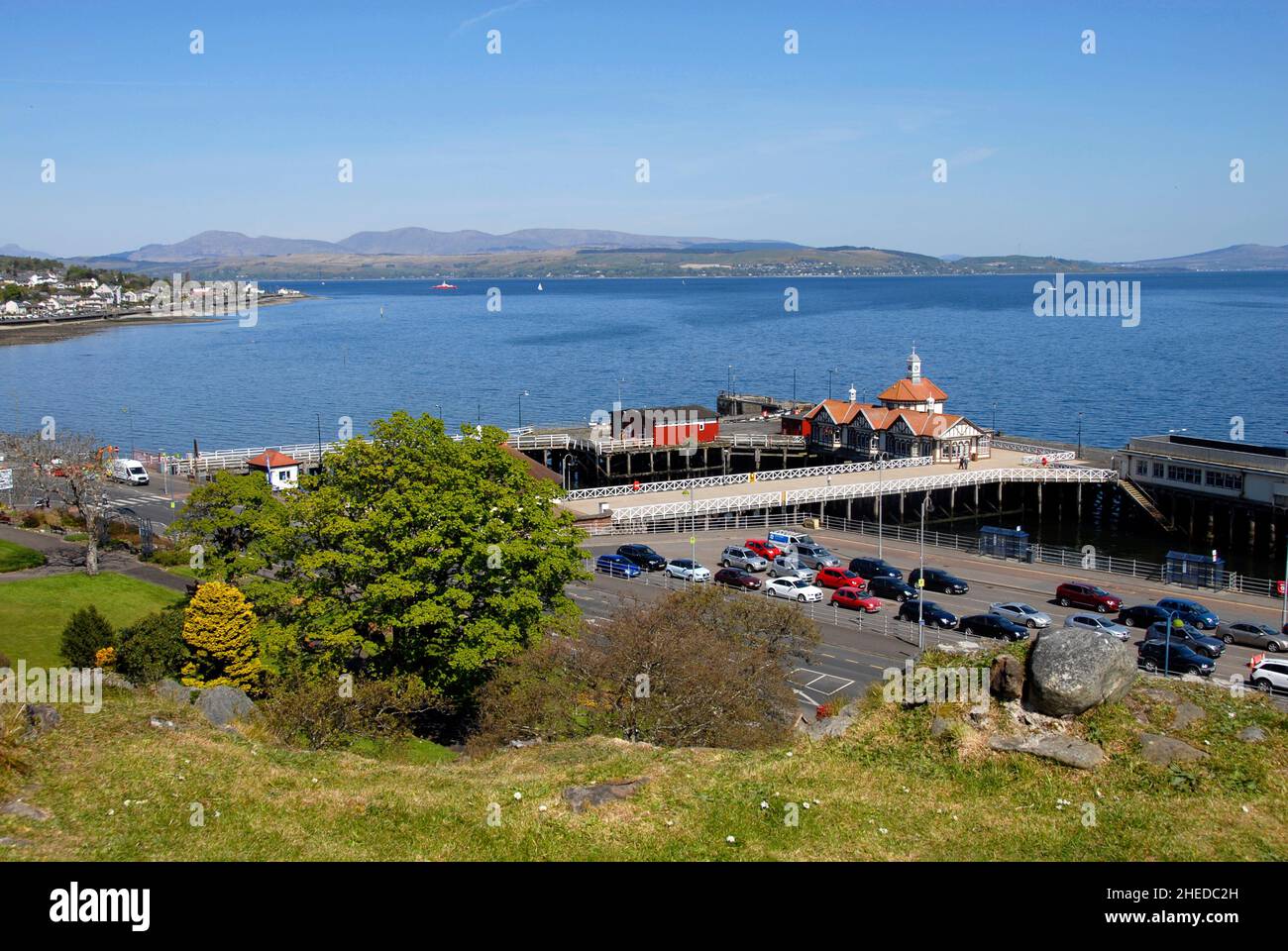 Vehicles waiting for the Dunoon/Gouroch ferry with the Victorian Pier beyond, Dunoon, Scotlamd Stock Photo