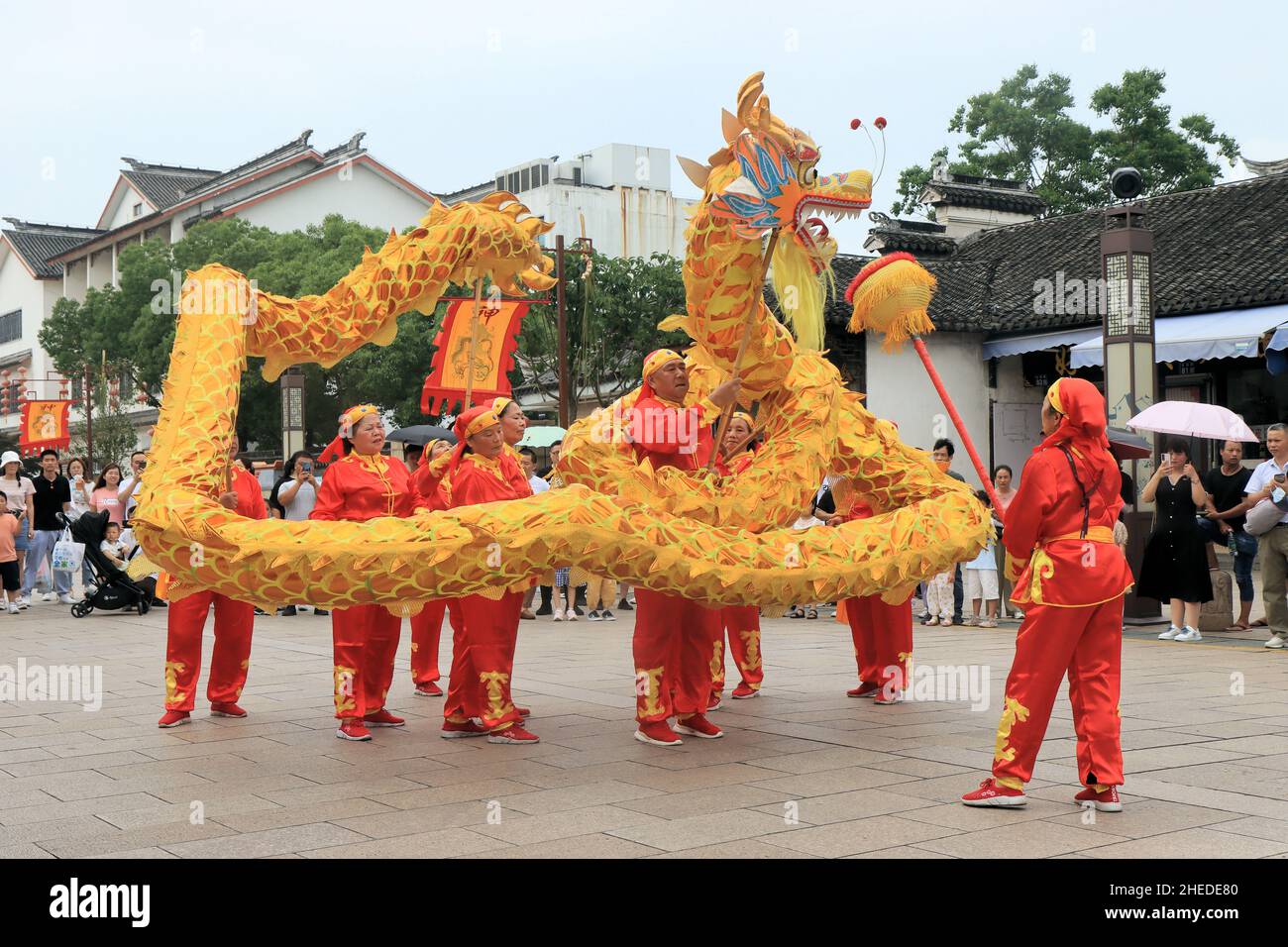 A traditional dragon dance is staged during Dragonboat Festival in the Chinese water town of Zhouzhuang near Shanghai Stock Photo