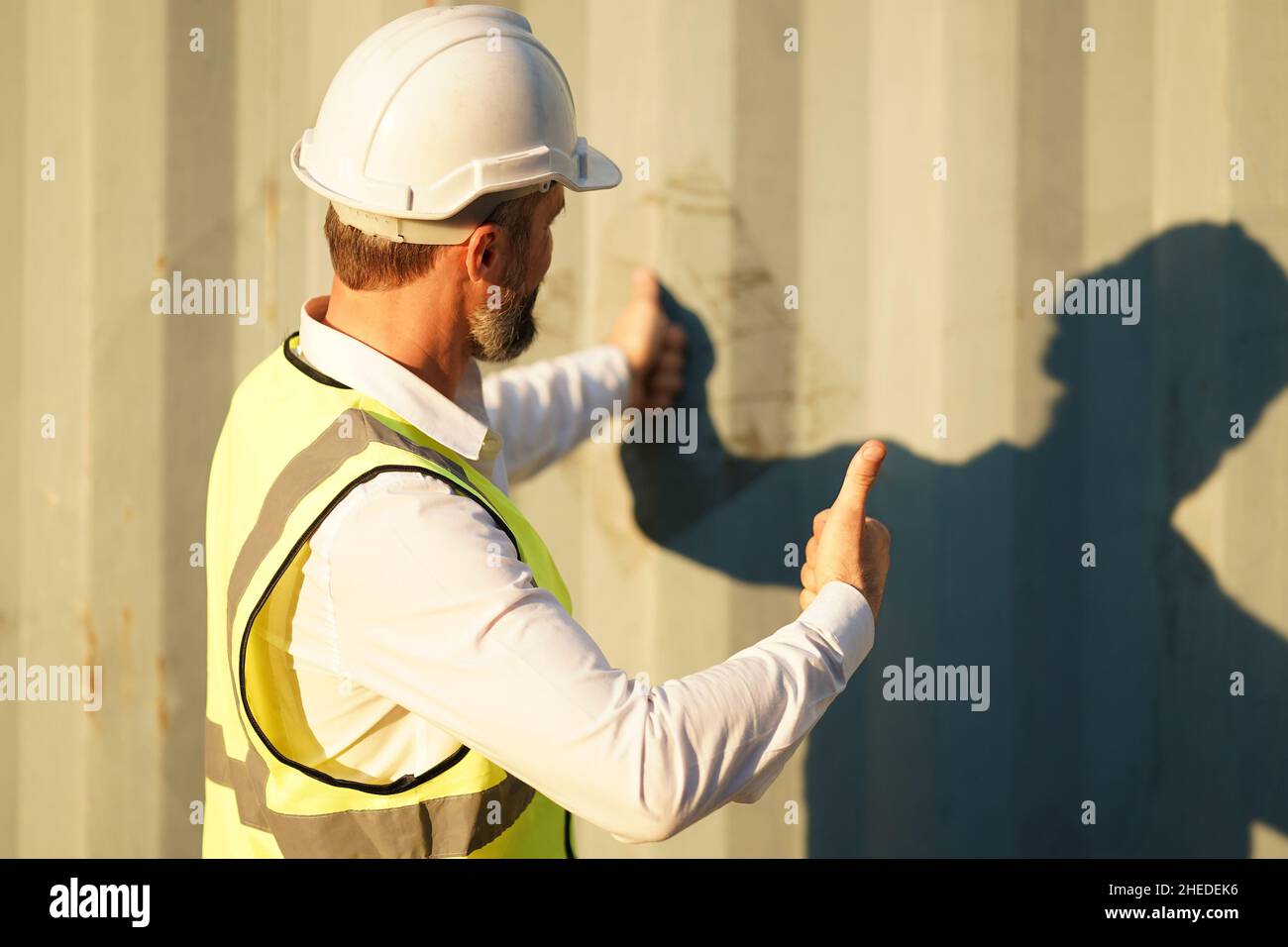 Foreman control loading Containers box from Cargo freight ship for ...