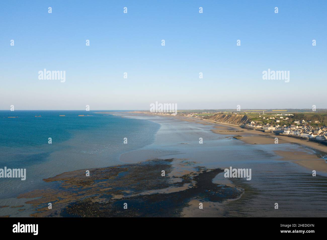 This landscape photo was taken in Europe, France, Normandy, Arromanches les Bains, in summer. We can see the fine sandy beach of Gold beach and its ar Stock Photo