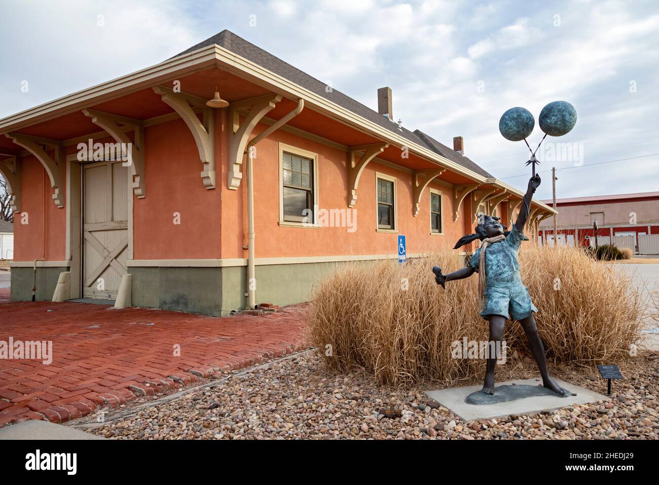 Concordia, Kansas - Statues of children adopted during the National Orphan Train movement are located outside the National Orphan Train Complex Museum Stock Photo