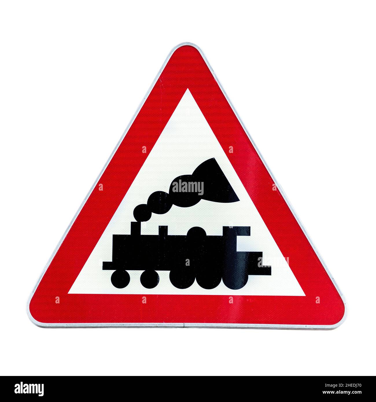 Railroad Level Crossing Sign without barrier or gate ahead the road Stock Photo
