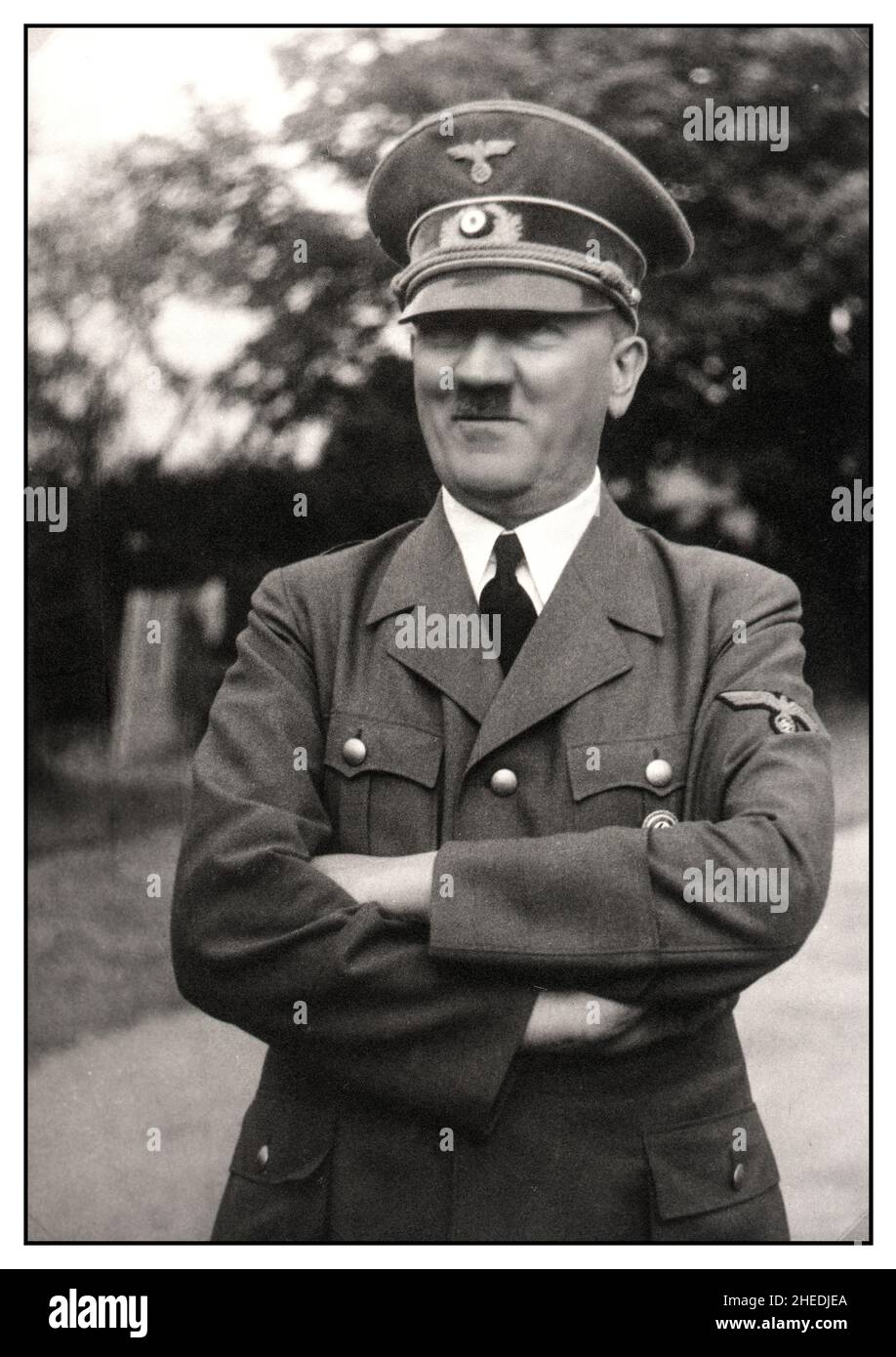 Adolf Hitler in uniform WW2  with arms folded, outside with confident smiling expression 1930s/1940s World War II Stock Photo