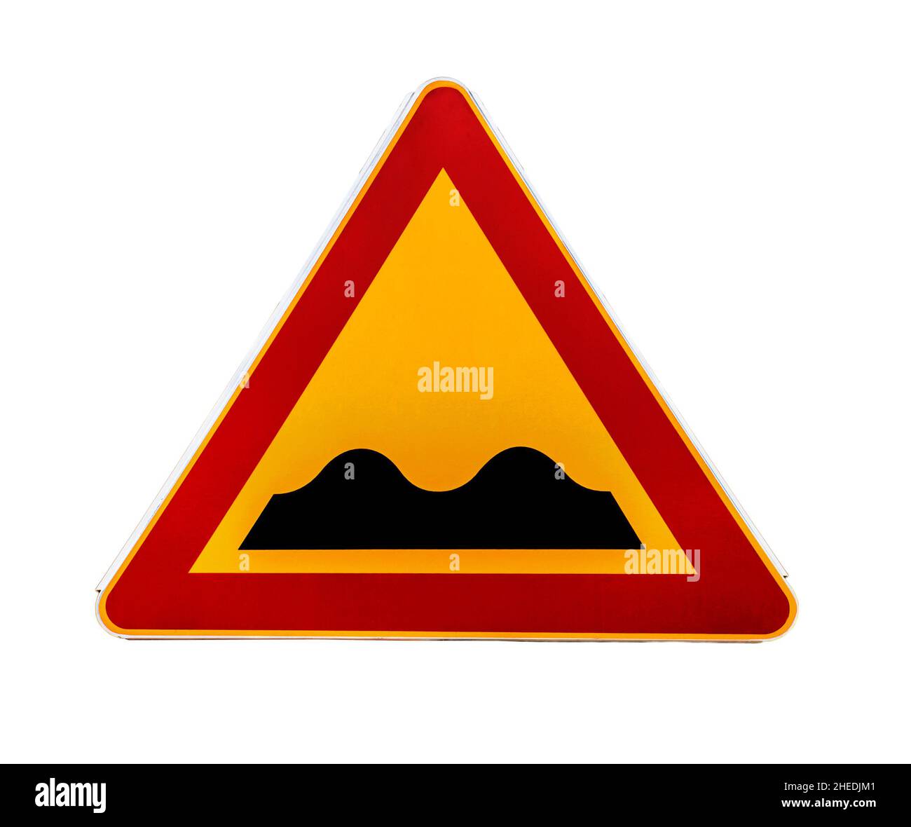 Red and yellow triangular warning road sign with a warning of a bumpy road ahead Stock Photo
