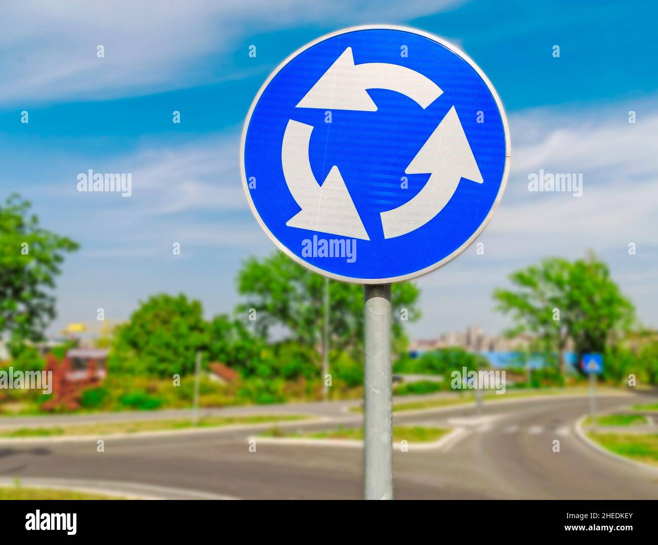 Red roundabout crossroad road traffic sign Stock Photo - Alamy