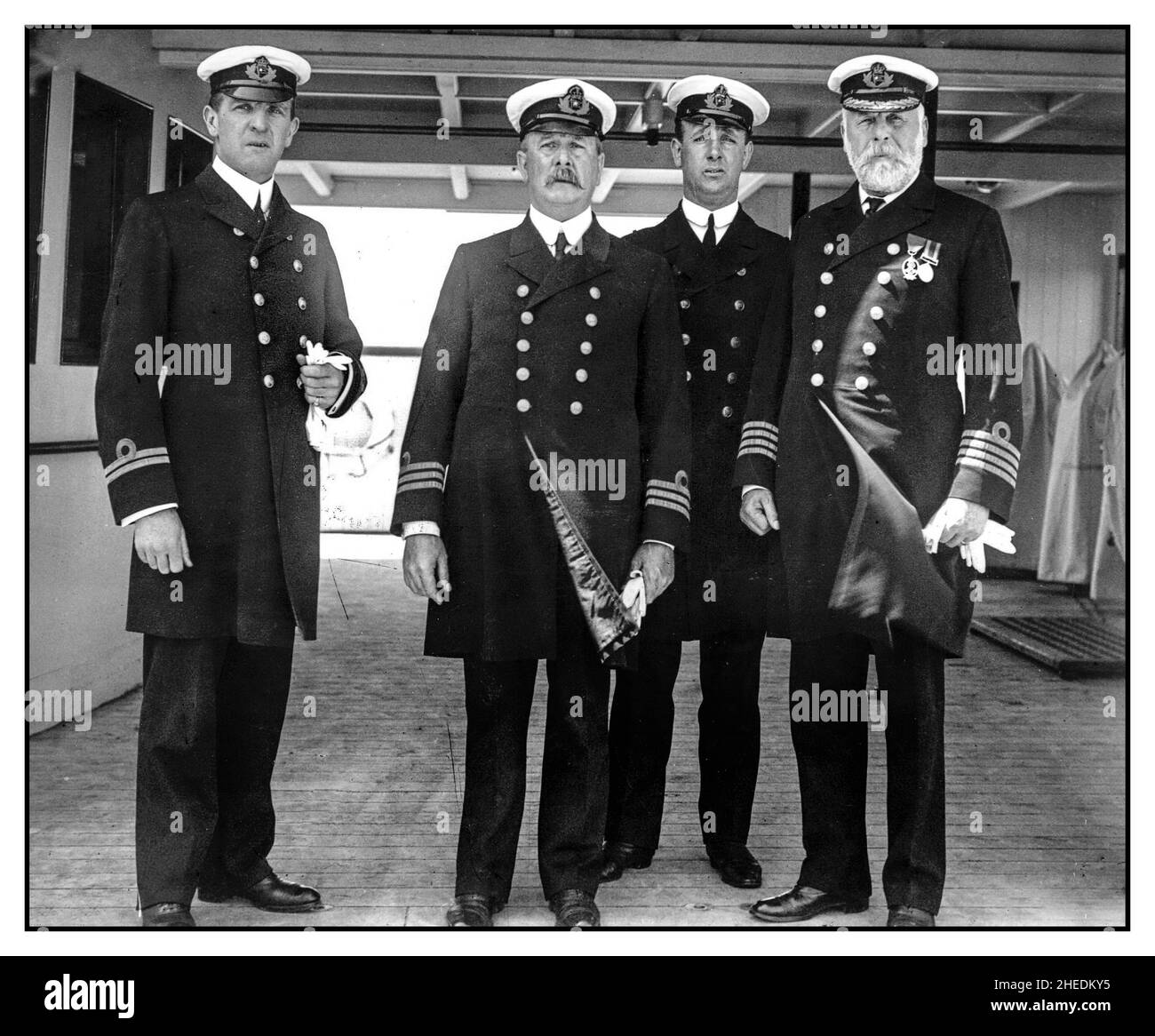 TITANIC /OLYMPIC 9th June 1911:  Officers of the White Star liner 'Olympic'  From left to right: First Officer William M Murdoch, Chief Engineer Joseph Evans, Fourth Officer David Alexander and Capt. Edward J. Smith seen on the Olympic.Captain Edward Smith most famous for his role at the helm of the Titanic, the disastrous last voyage in his successful career at sea Stock Photo
