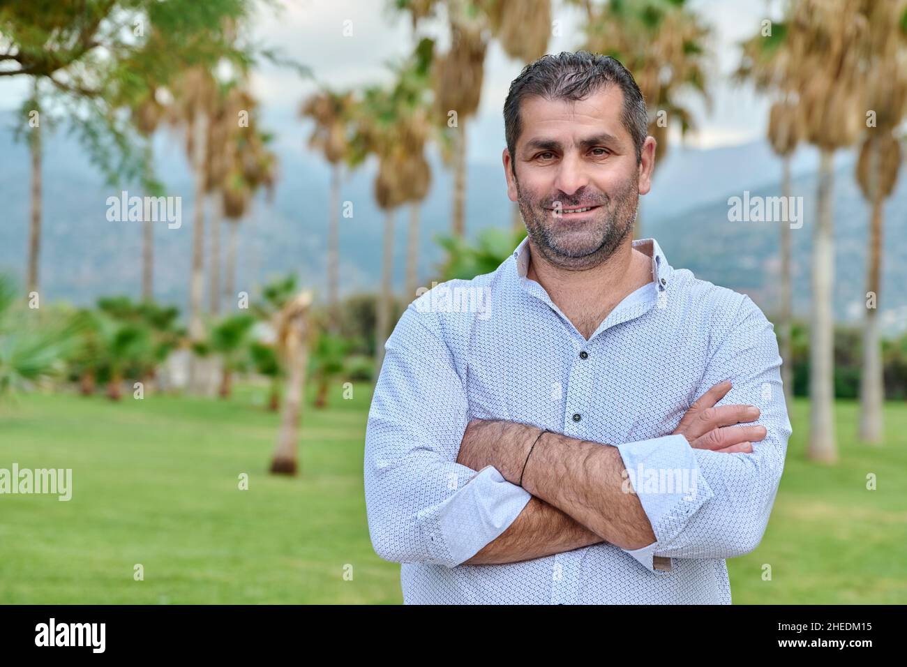 Outdoor portrait of mature confident man looking at camera, copy space Stock Photo