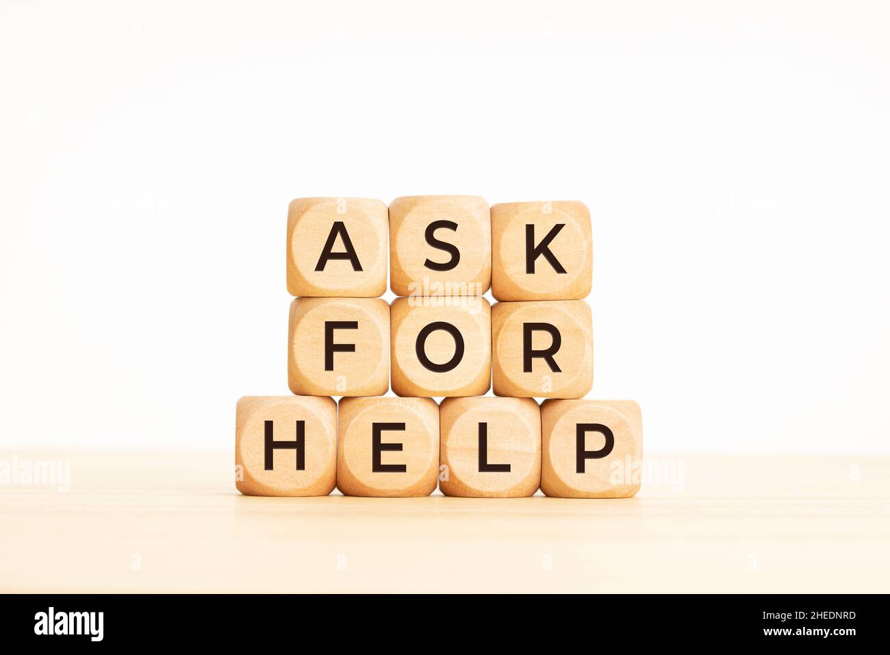 Ask for Help phrase on wooden blocks. Copy space Stock Photo