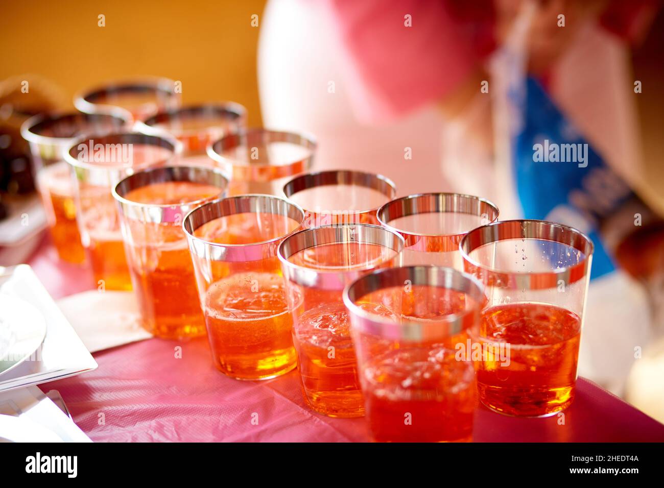 Bright orange alcohol cocktails in a row. Setting on catering banquet table. Party and holiday celebration concept. Copy space. High quality photo Stock Photo