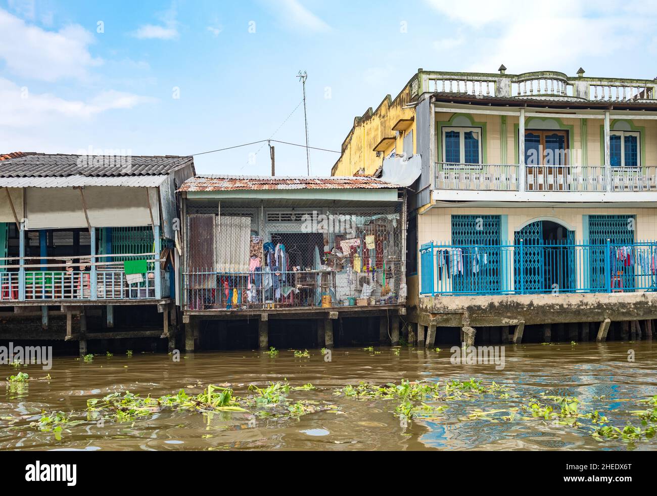 Vietnam, houses on stilts on the Mecong river delta Stock Photo Alamy