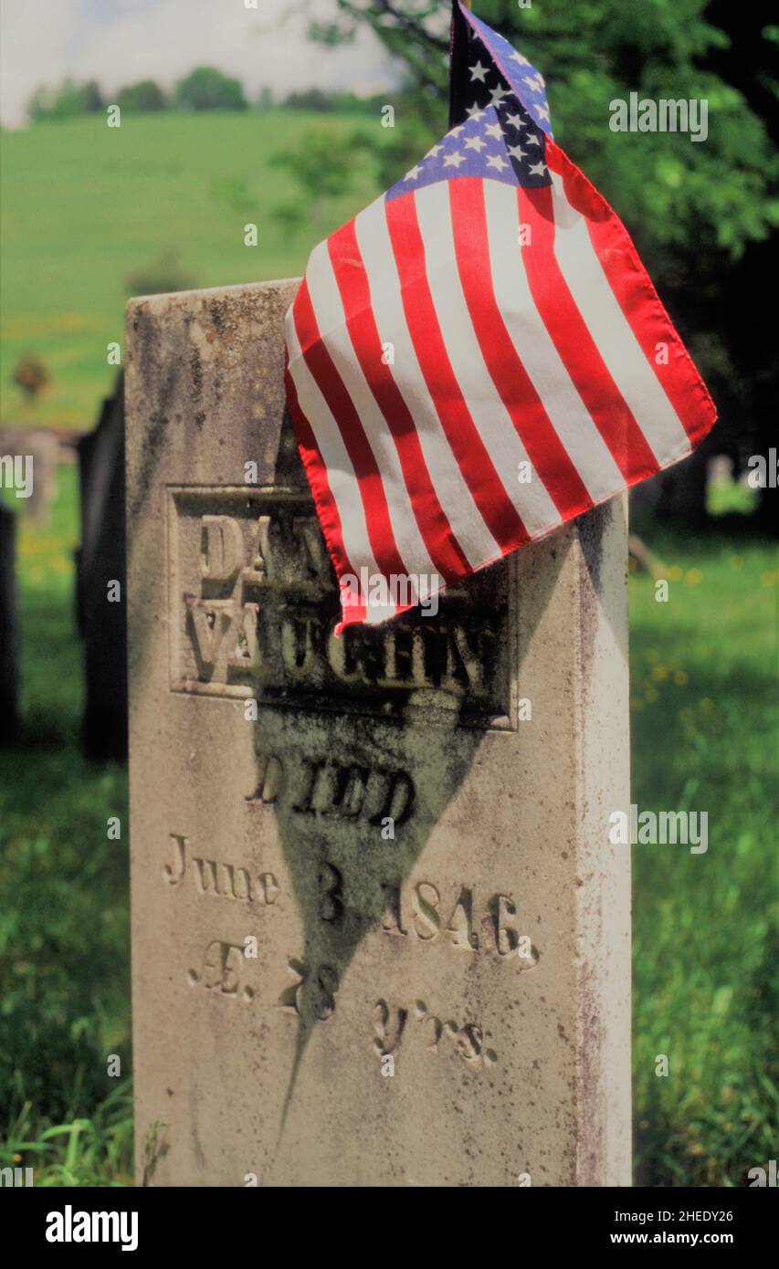 American flag over cemetery headstone - Woodstock, Vermont Stock Photo
