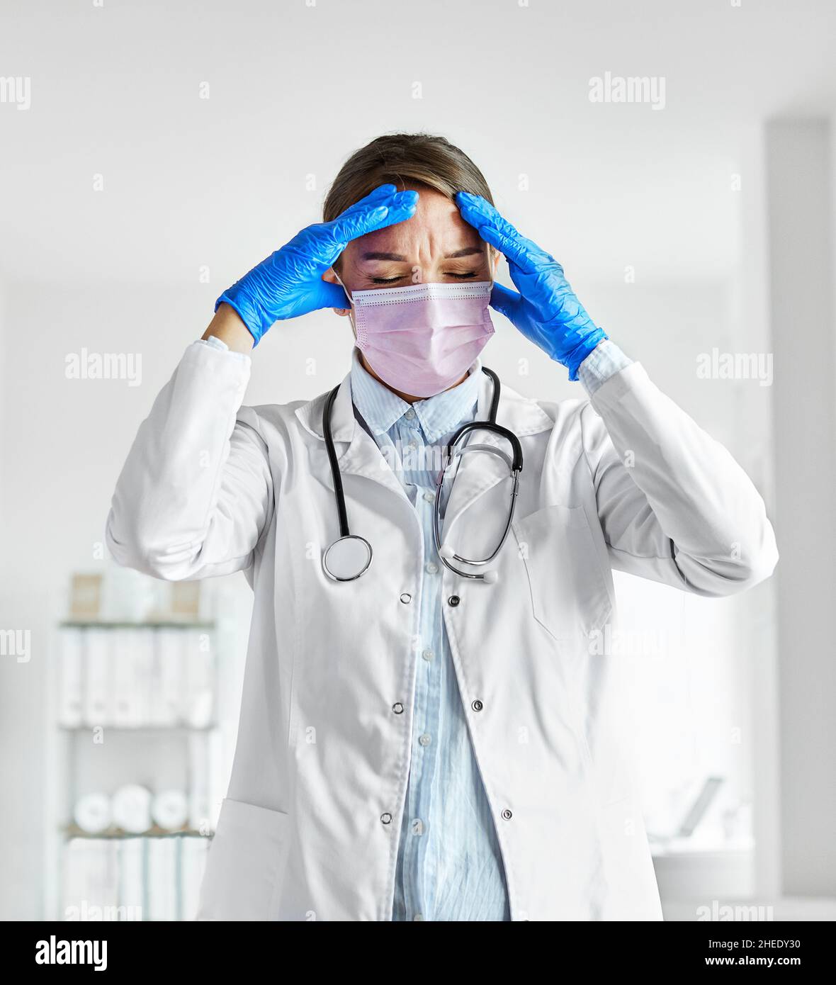 doctor medical mask exhausted hospital coronavirus health tired virus woman nurse pandemic care medicine Stock Photo