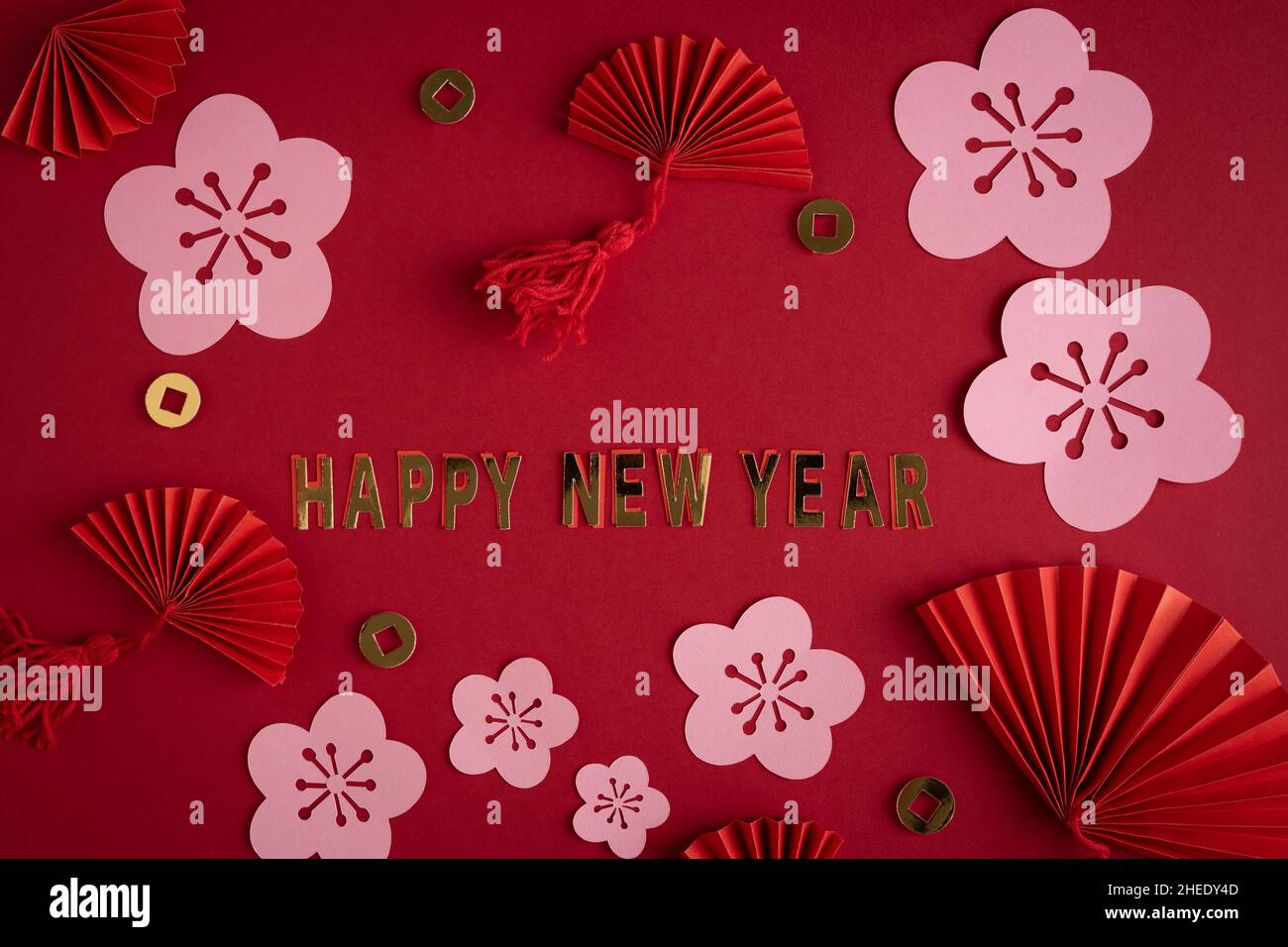 Chinese New Year. Decoration with traditional Chinese New Year motifs, cut  out paper decorations on red cardboard background. Copy space Stock Photo -  Alamy