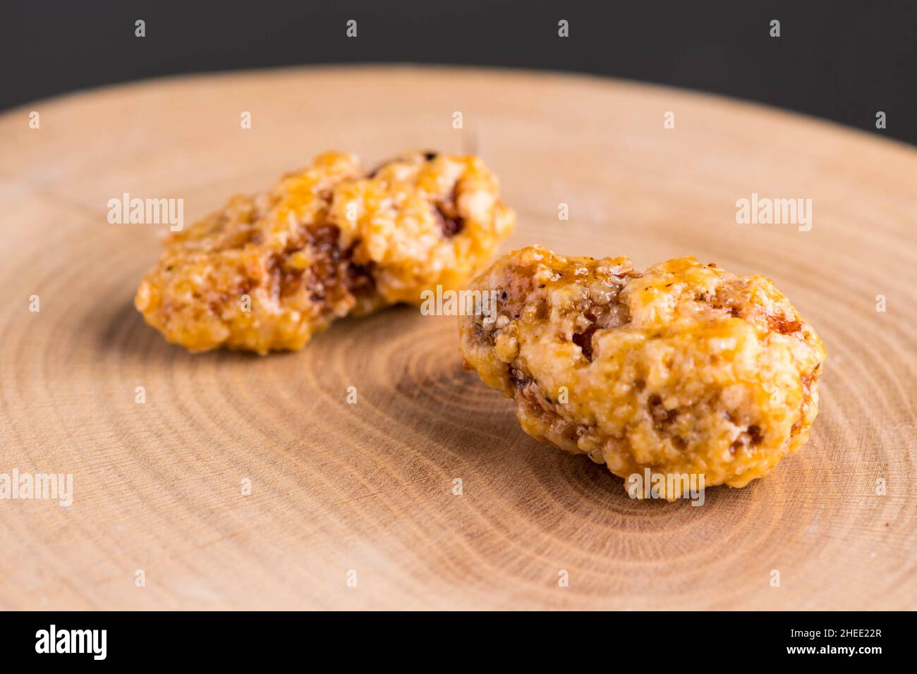 Two roasted almonds on wood Stock Photo
