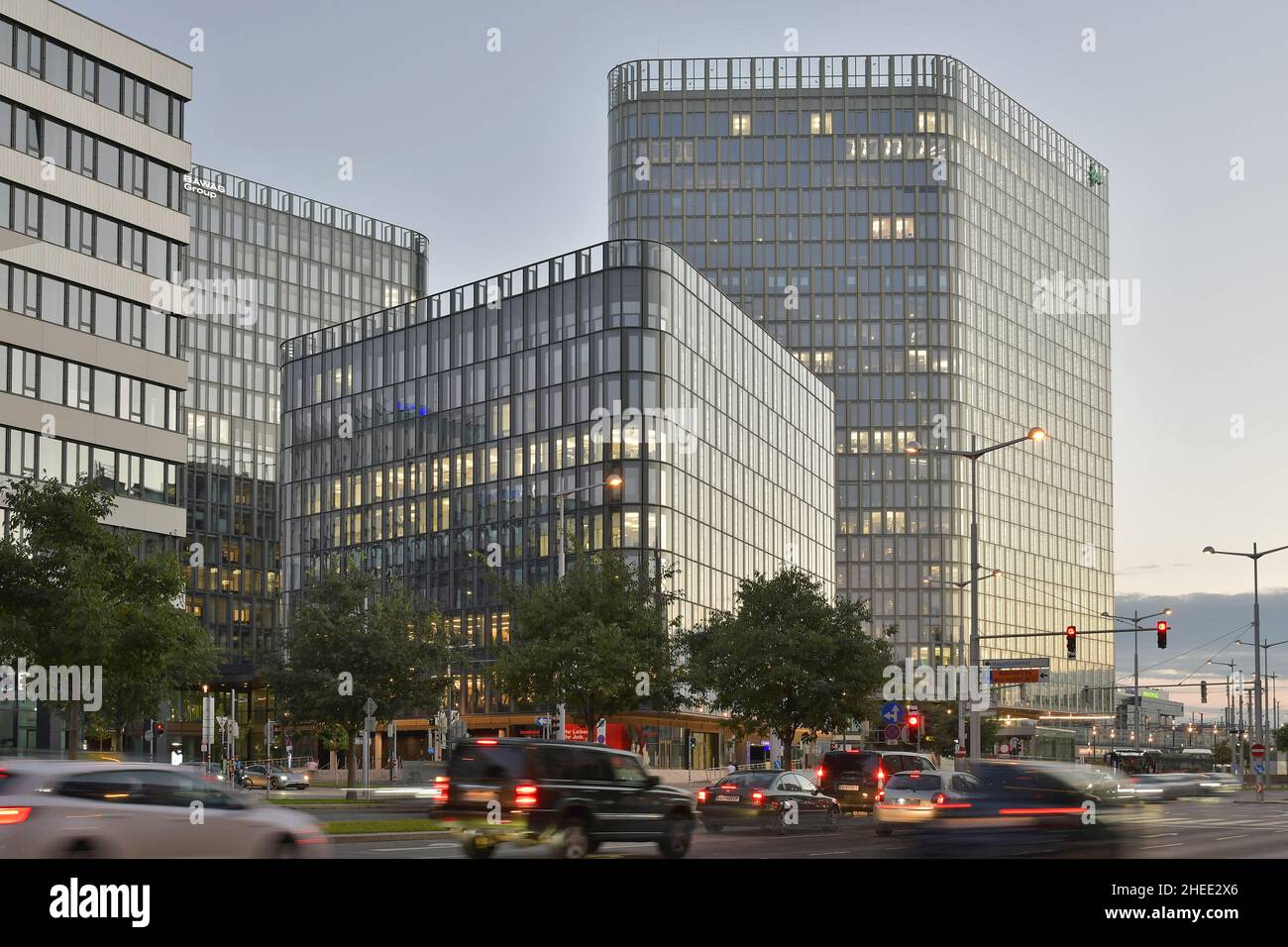 Modern glass office buildings and driveway at dusk, Wiener Gürtel road in Vienna Austria. Stock Photo