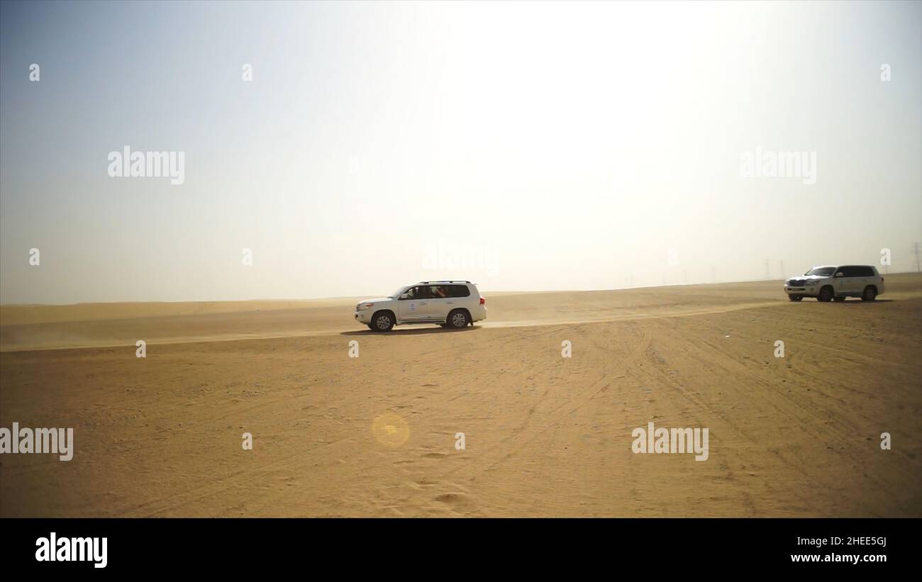 Desert Safari SUVs bashing through the arabian sand dunes. SUV tour