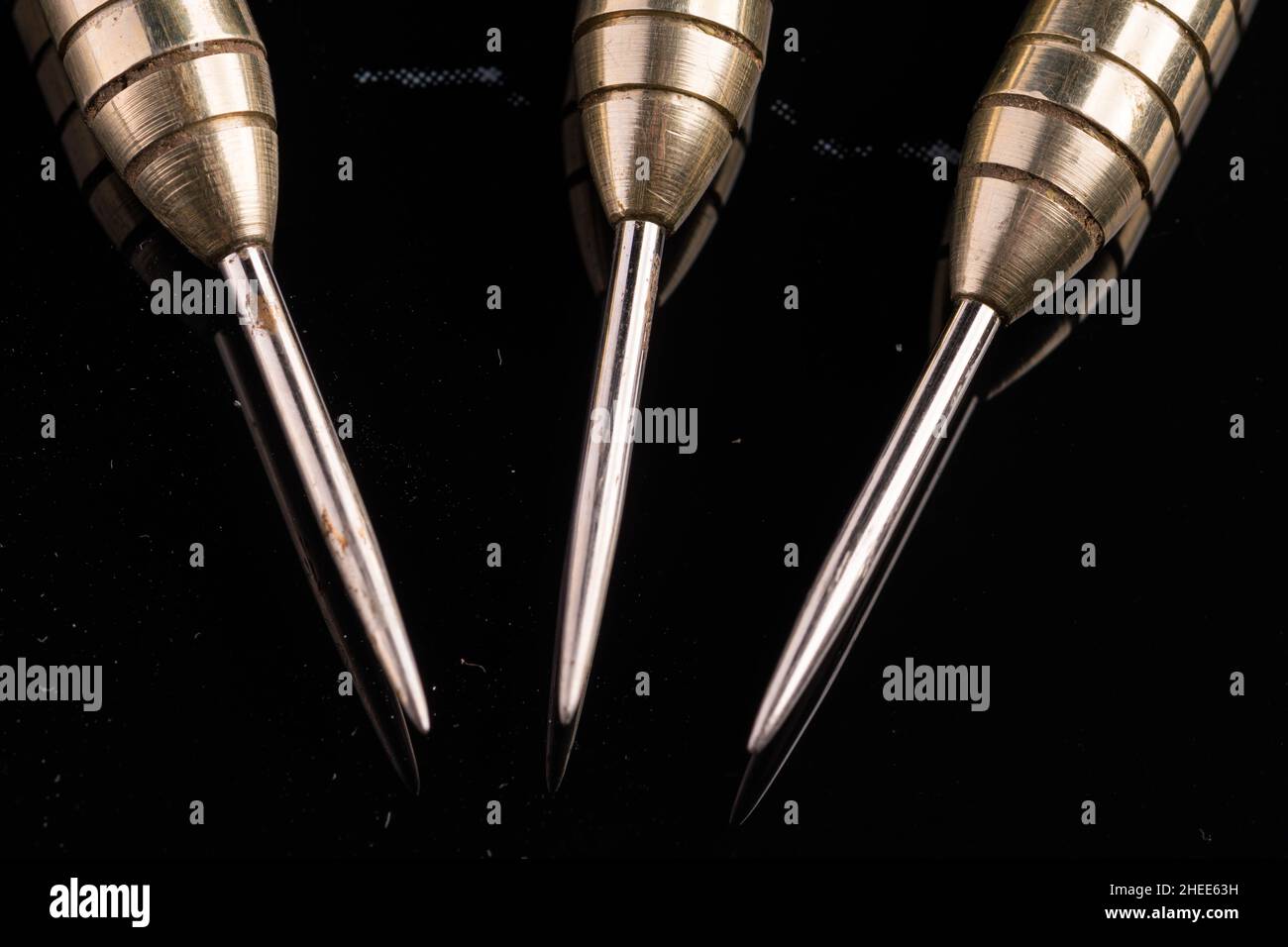 Three arrows dart tips on black with text space Stock Photo