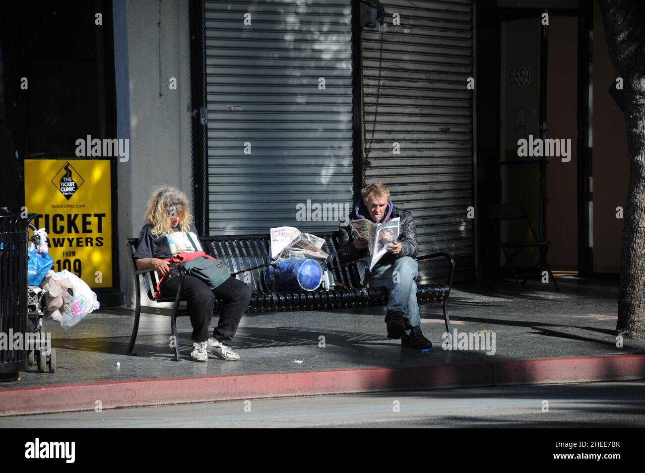 Random unidentified people, tourist and street entertainer in the streets of city of Hollywood, CA. Stock Photo
