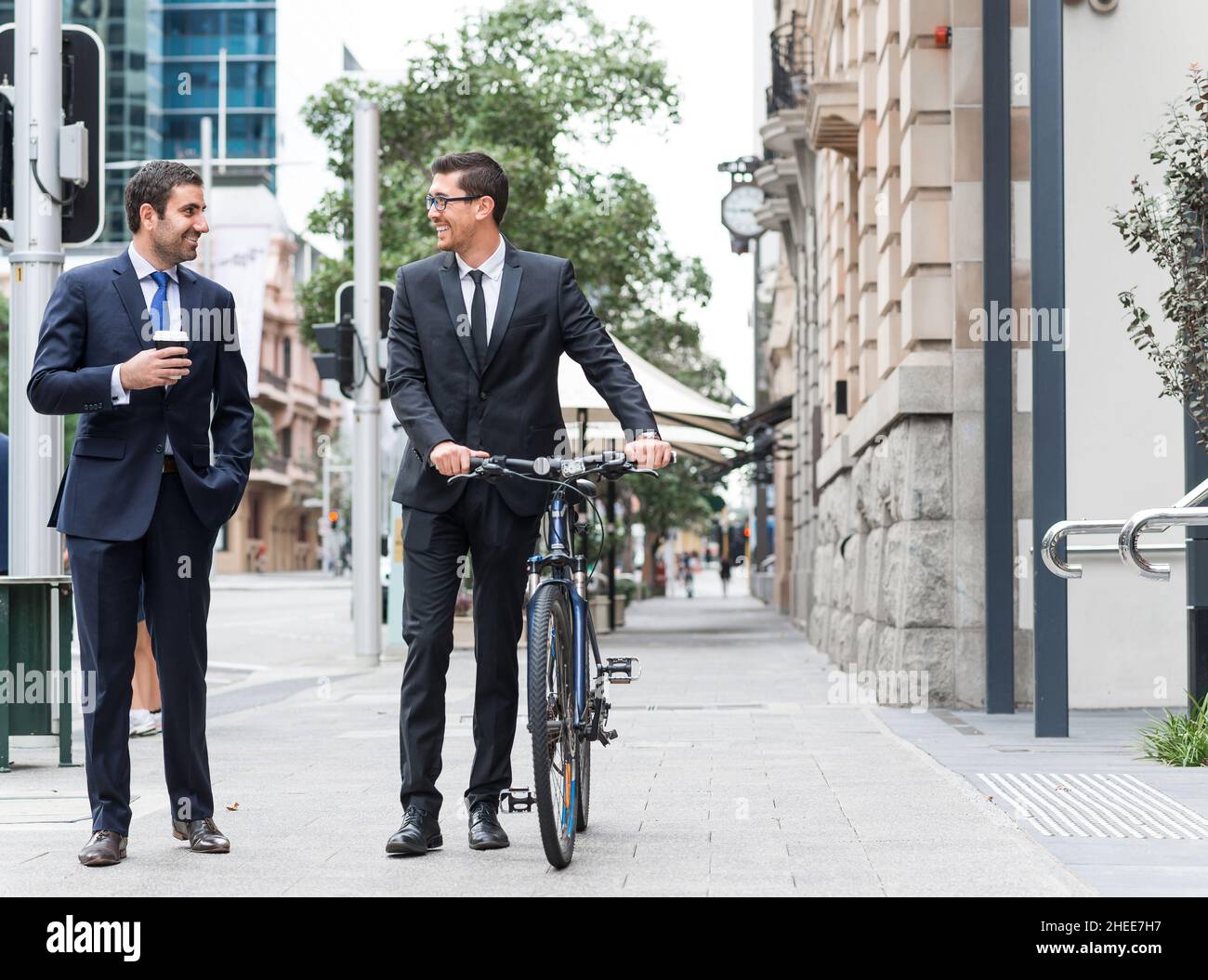 Two businessmen having walk Stock Photo - Alamy