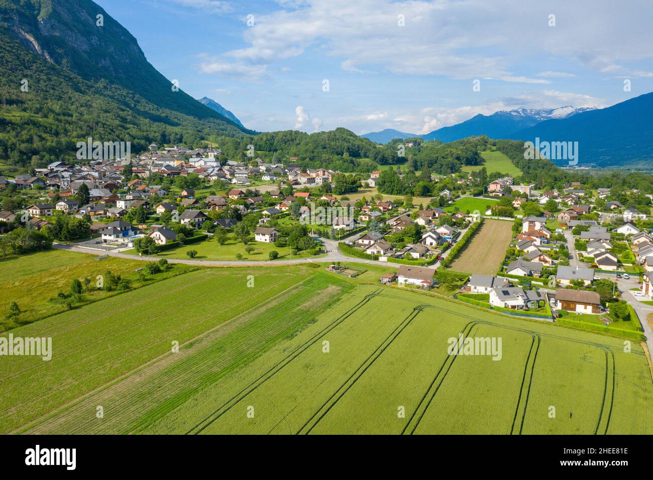 This landscape photo was taken in Europe, in France, in Isere, in the Alps, in summer. We can see the city of Gresy sur Isere, under the Sun. Stock Photo