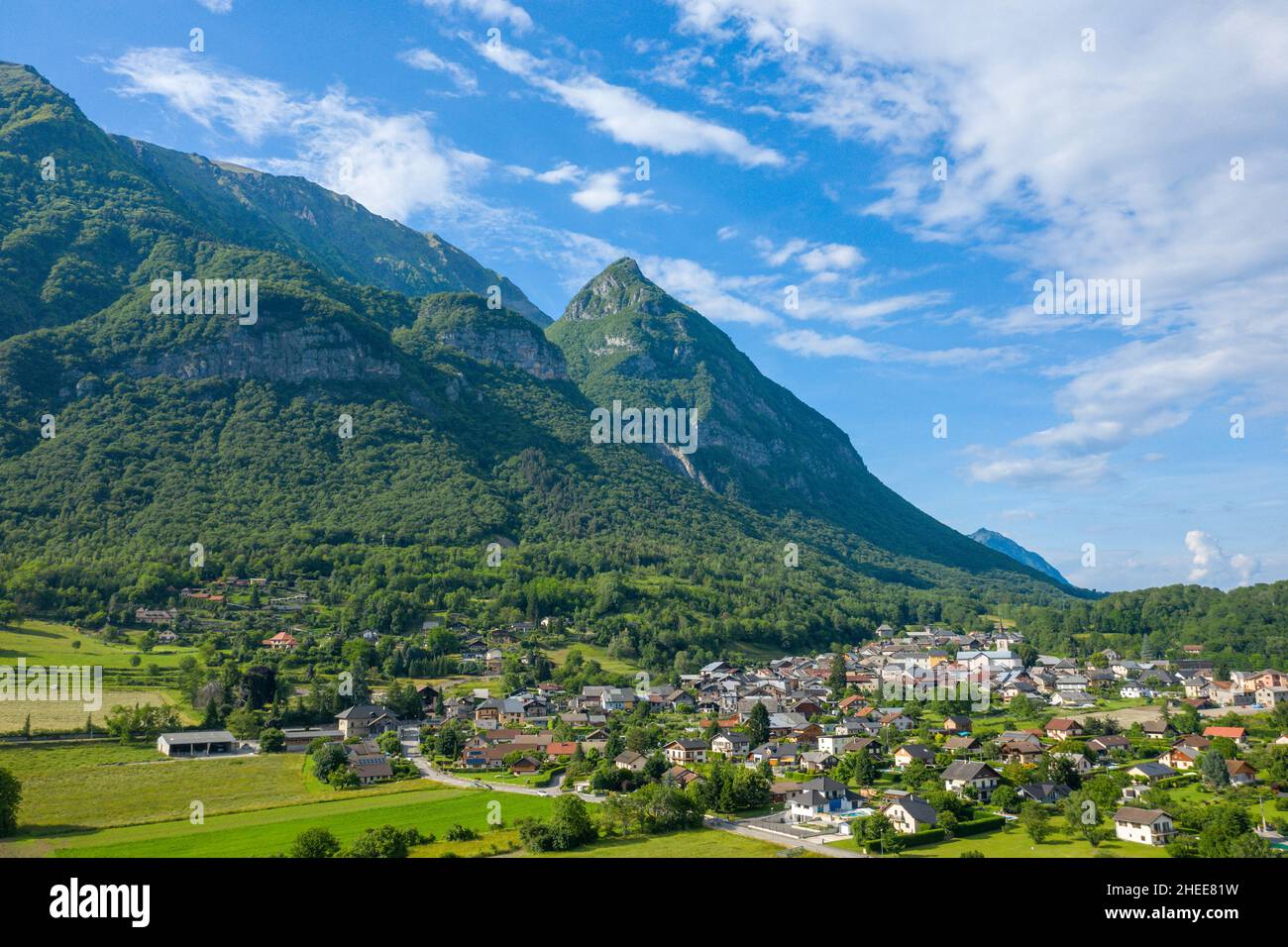 This landscape photo was taken in Europe, in France, in Isere, in the Alps, in summer. We can see the city of Gresy sur Isere under its mountain, unde Stock Photo