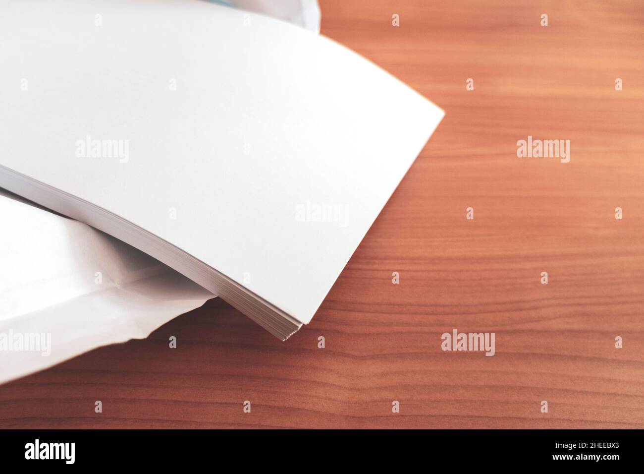 printing and photocopy paper. stack of sheets of a pack of office paper on a table. paper for high volume printing and copying. Copy space Stock Photo