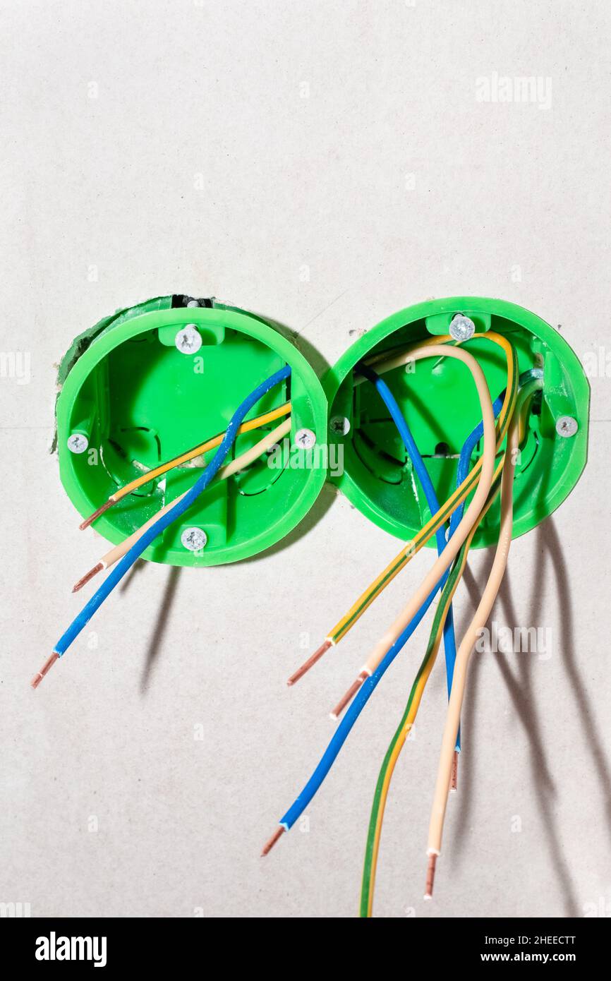 Boxes for electrical outlets with wires. Carrying out electrical wiring and installation of