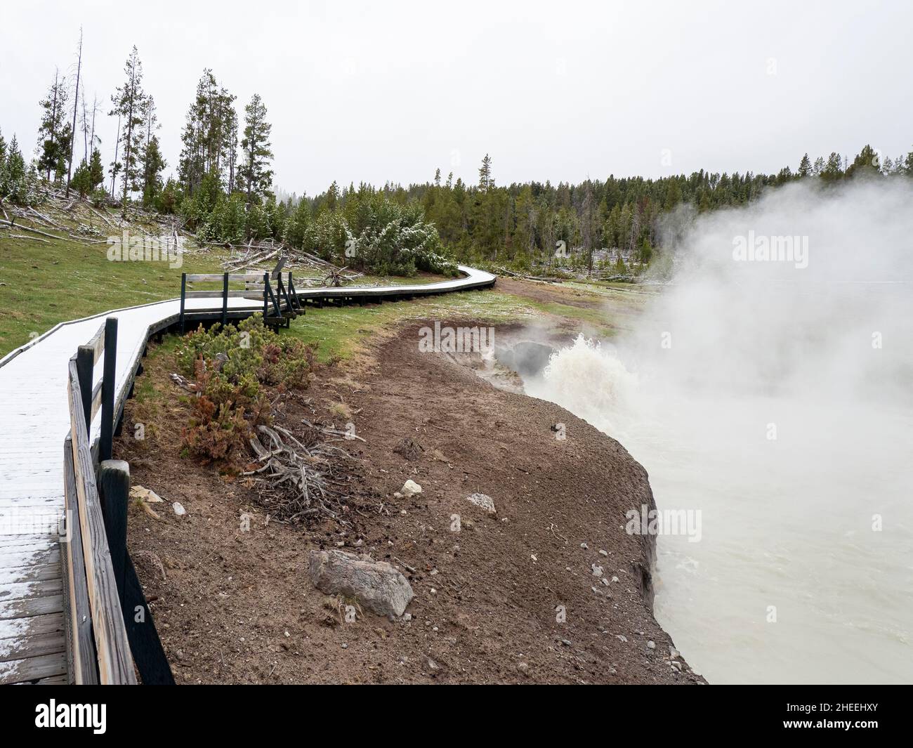 The boardwalk near mud pot in the mud volcano area of Yellowstone National Park, Wyoming. Stock Photo