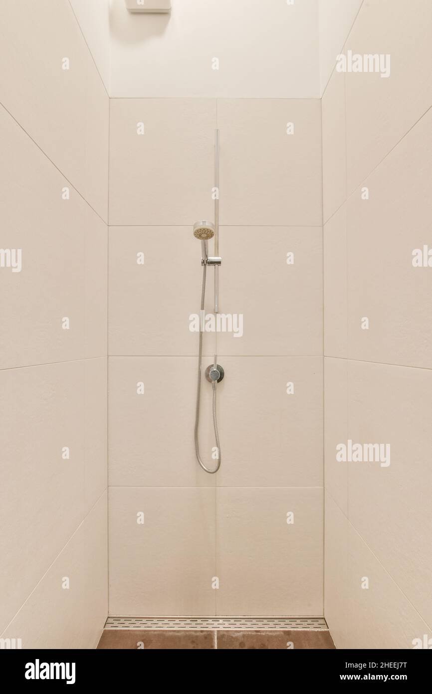 Light empty shower cabin with metal set in modern bathroom with white ...