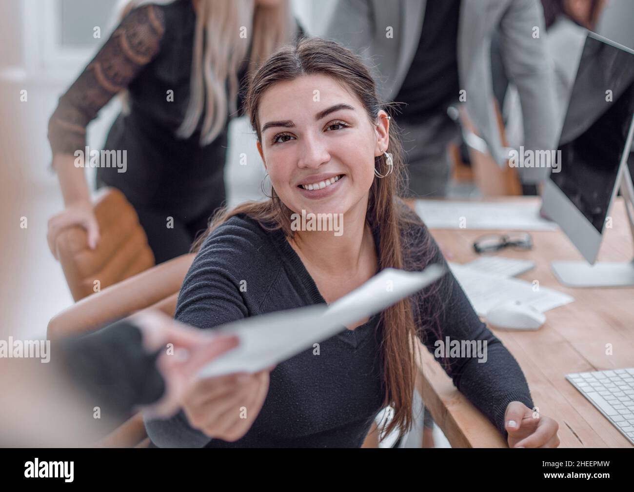 group of employees work on computers in the office Stock Photo - Alamy