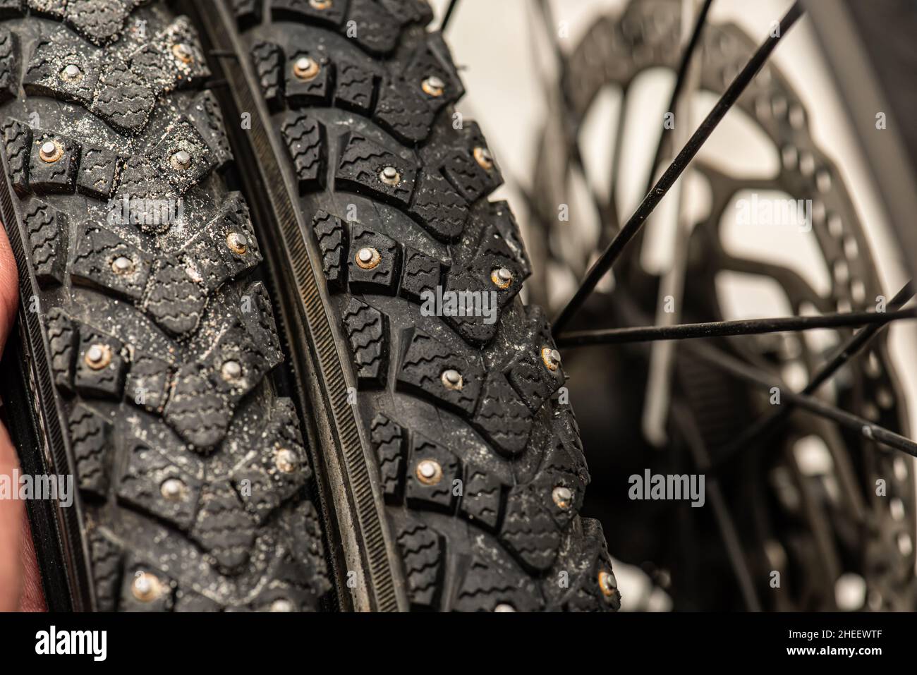 Fully studded winter bicycle tires Stock Photo Alamy