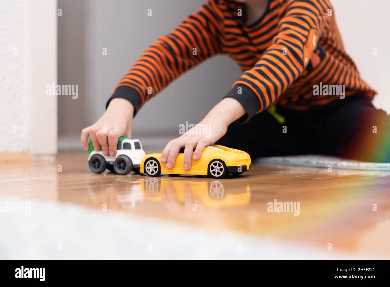 Boy playing toy cars. Kid with toys. Child and car at home Stock Photo ...