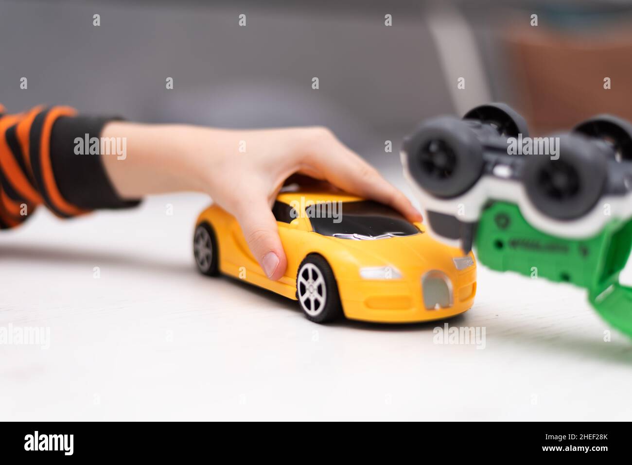 Boy playing toy cars. Kid with toys. Child and car at home Stock Photo ...