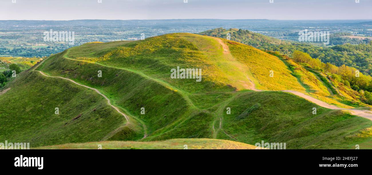 Low angled summer morning sunlight,clipping the summit and pathways of ...