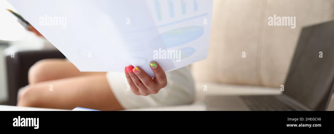 Lady analyze monthly report Stock Photo