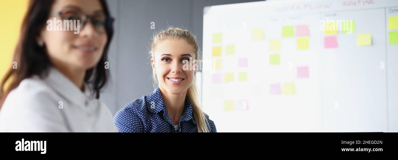 Smiling female on working place Stock Photo